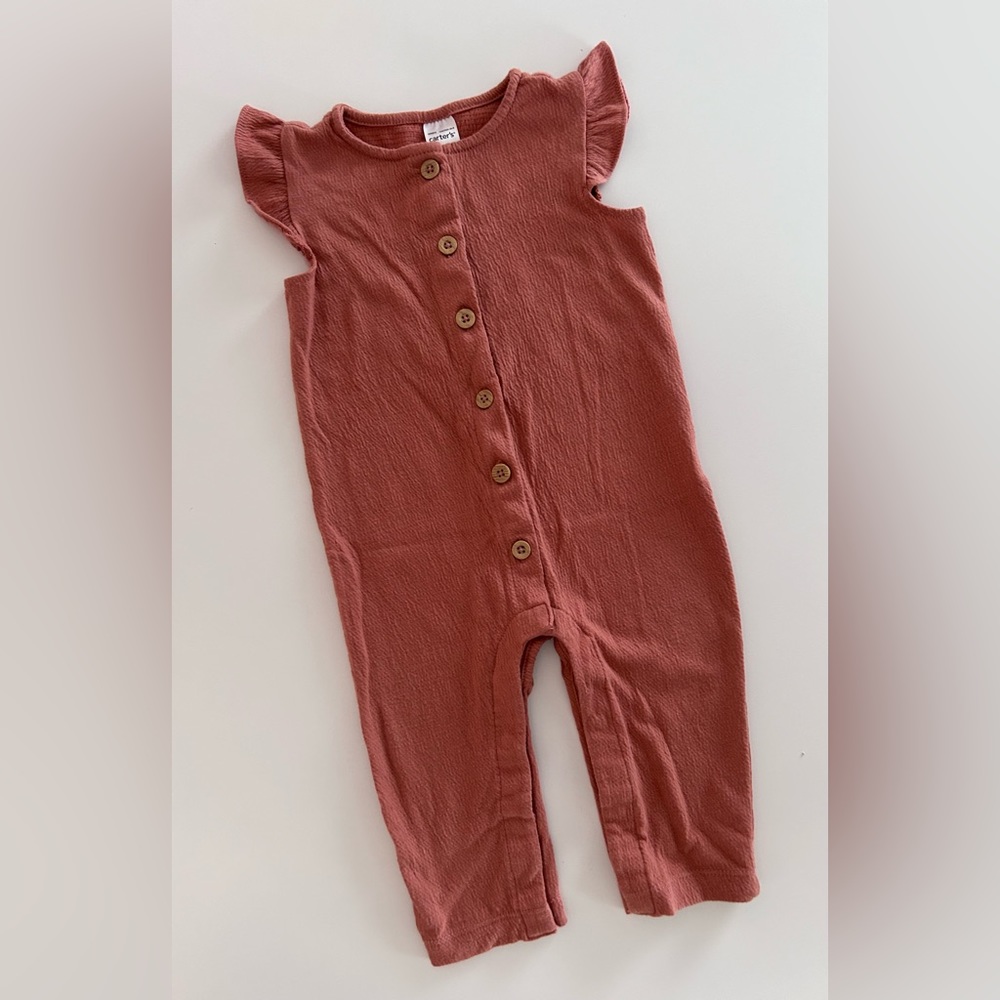 9 month old Carter’s ruffle sleeve textured romper with wood detail buttons